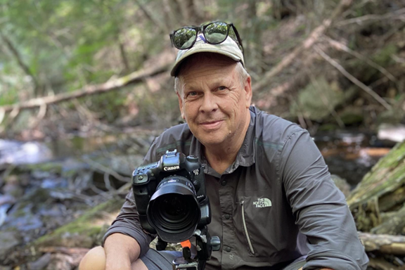 Michelle Saunders, an Inuk biologist and researcher with the Nunatsiavut government, stands near the shoreline at Basecamp, located near Torngat Mountains National Park. “I take a holistic approach to my research, which means that the land, water, animals and people are interconnected. I don’t study biology for the sake of studying biology,” she continues. “I study what is important to Nunatsiavut communities, like the health of marine life and how it is impacting our food.”